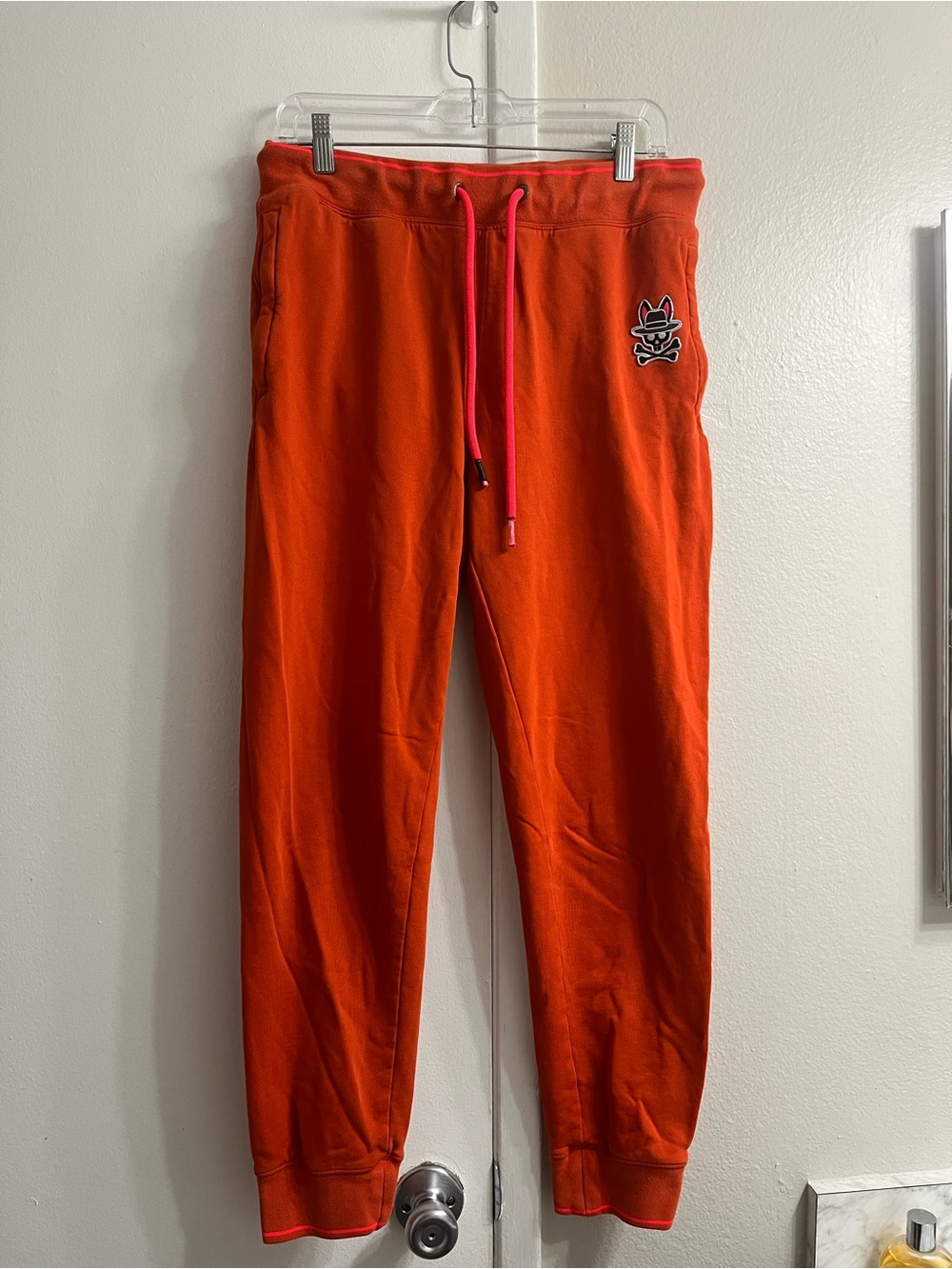 Psycho Bunny Orange Joggers with Pink Drawcord